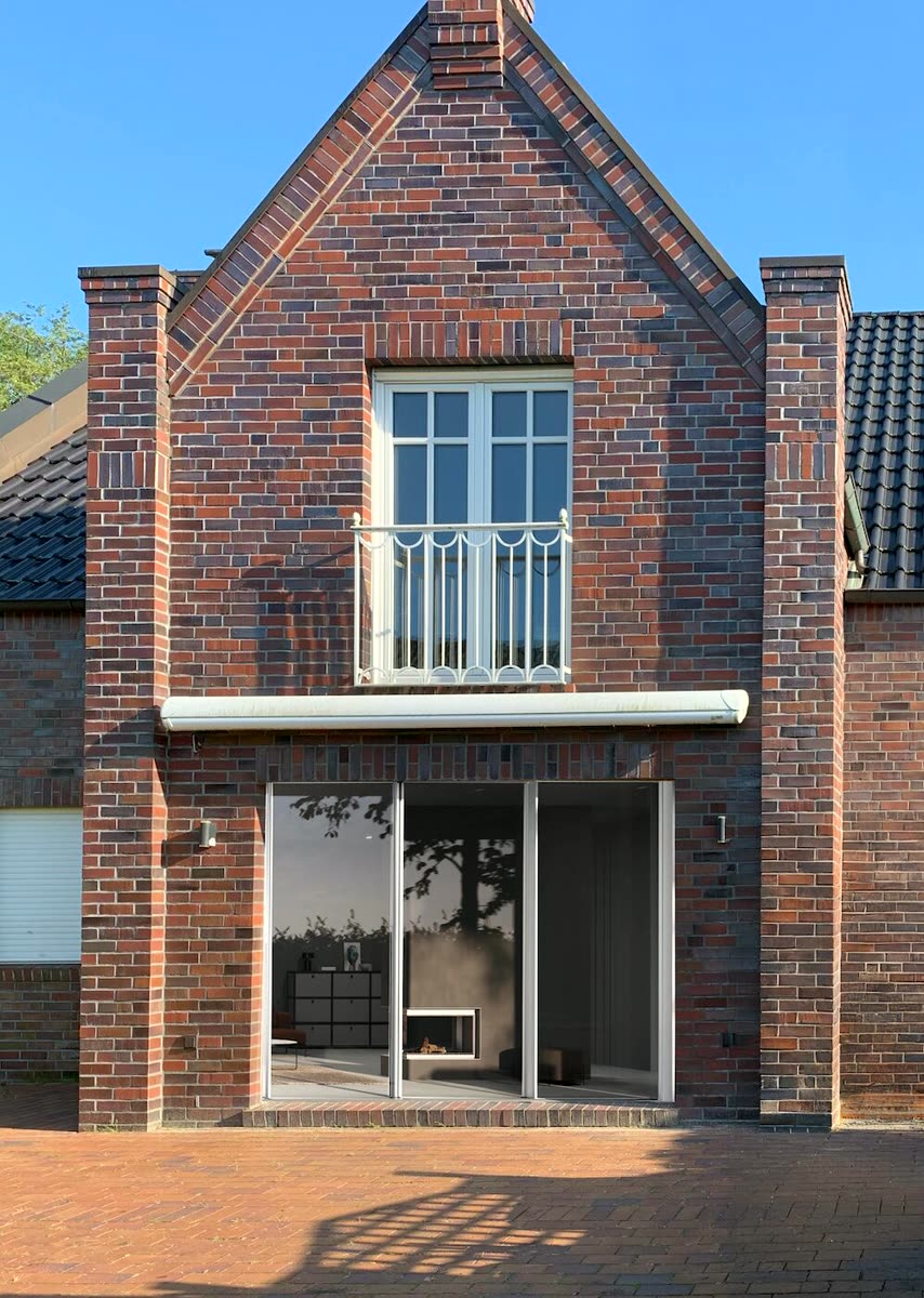 Klinker-Neubau mit rahmenloser superview Schiebetür